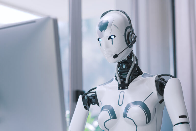 AI robot sitting at the desk and working in the office.