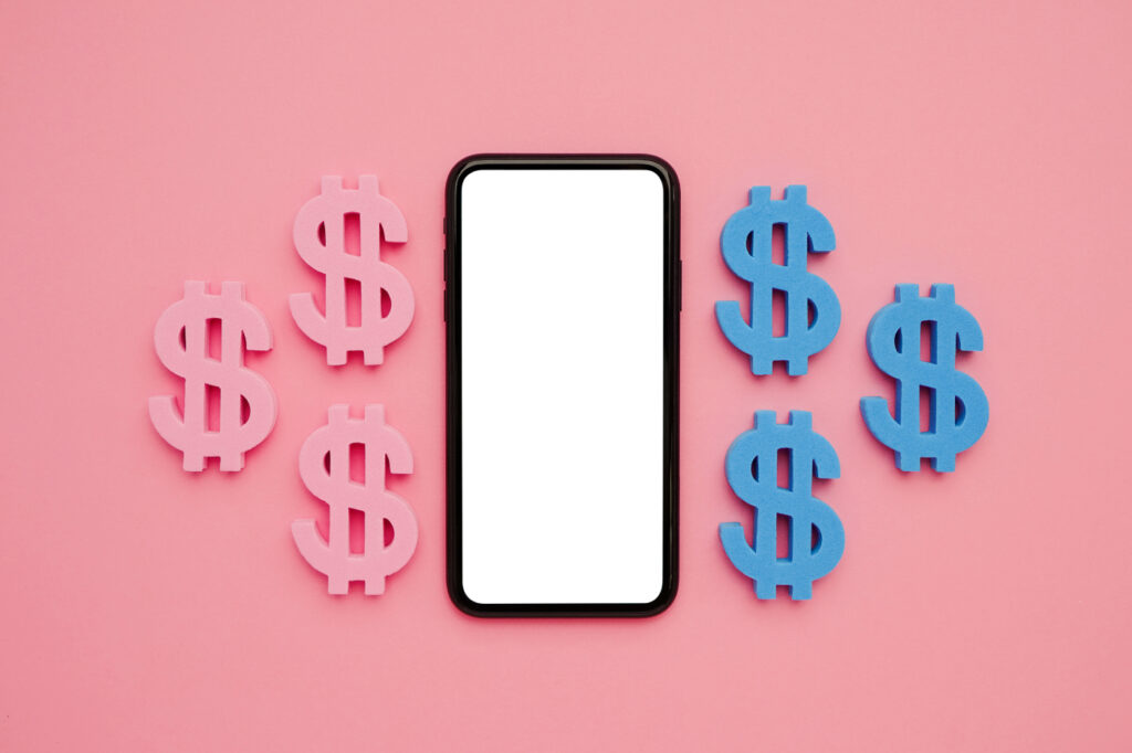 Mobile phone and american dollar symbol on pink background.