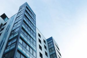 commercial building with blue skies behind it