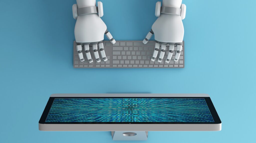 Top view of Robot hands using keyboard in front of a computer monitor with binary number code screen.